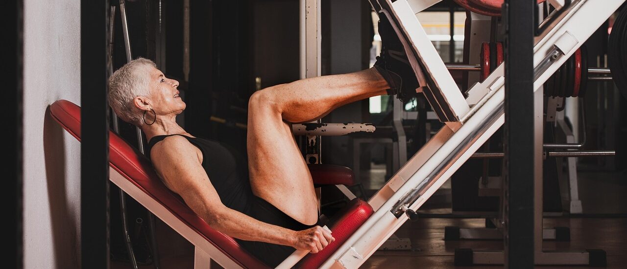 Woman doing leg press at gym