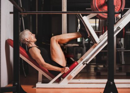 Woman doing leg press at gym