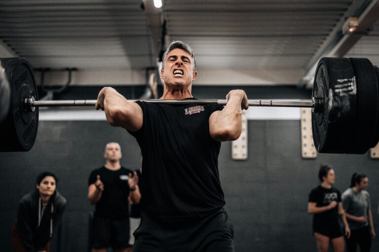 Man 40+ lifting heavy weights